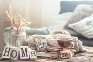 Free photo still life details of home interior on a wooden table with letters home, the concept of coziness and home atmosphere .living room