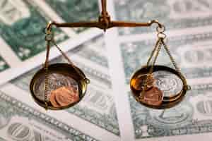 Free photo still life of dollar coins in scale