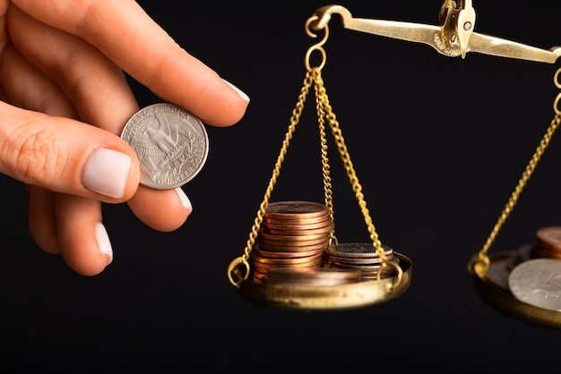 Free photo still life of dollar coins in scale