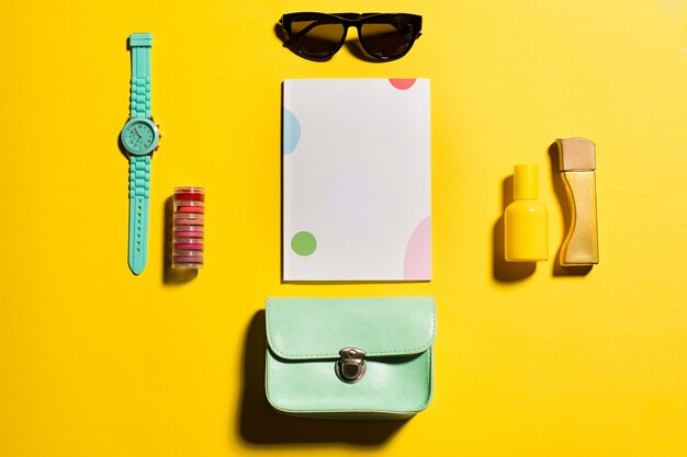 Still life of fashion woman, objects on yellow