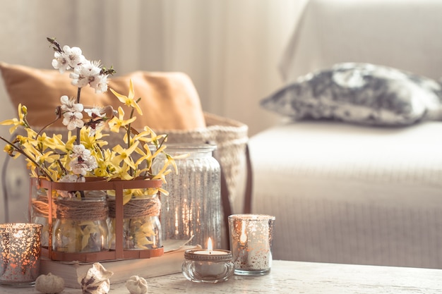 Free photo still life flowers with decorative objects in the living room