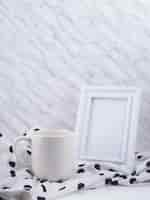 Free photo still life of frame and mug