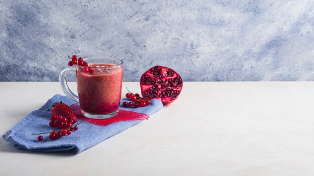 Still life of healthy pomegranate smoothie