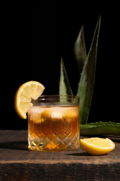 Still life of mezcal drink with maguey worm