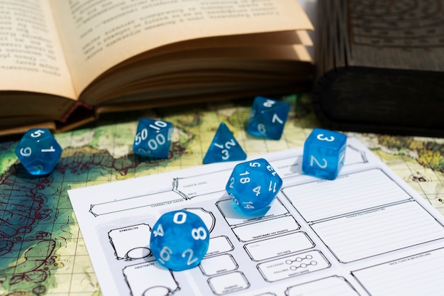 Free photo still life of objects with role playing game sheet