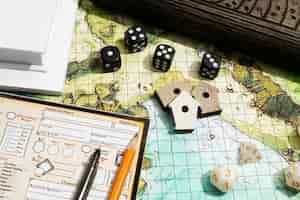 Free photo still life of objects with role playing game sheet