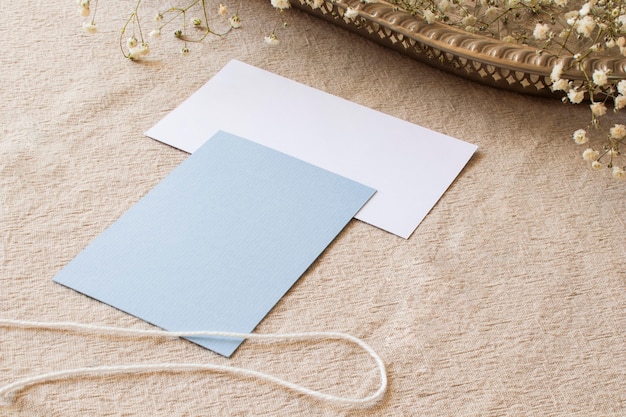 Still life papers on beige tablecloth