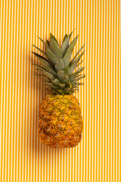 Still life of pineapple fruit with stem and leaves