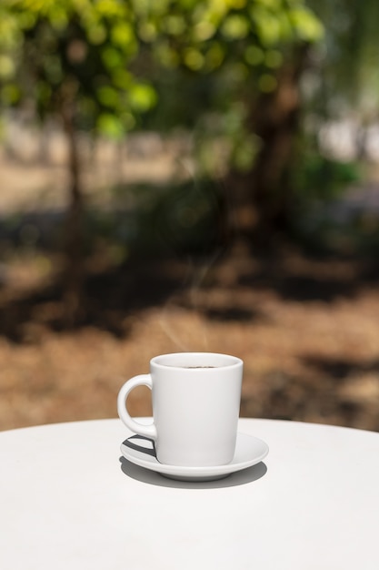Still life of relaxing coffee cup on terrace