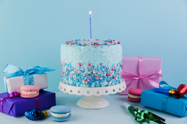 Still life of tasty birthday cake with presents