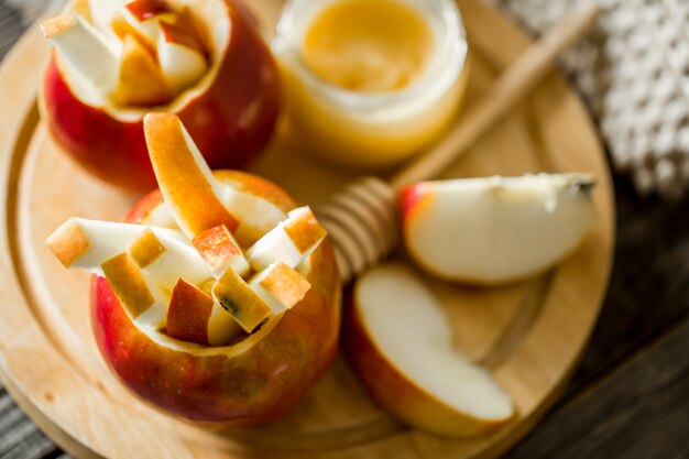 Still life with apples on wood. Apples cut into strips.