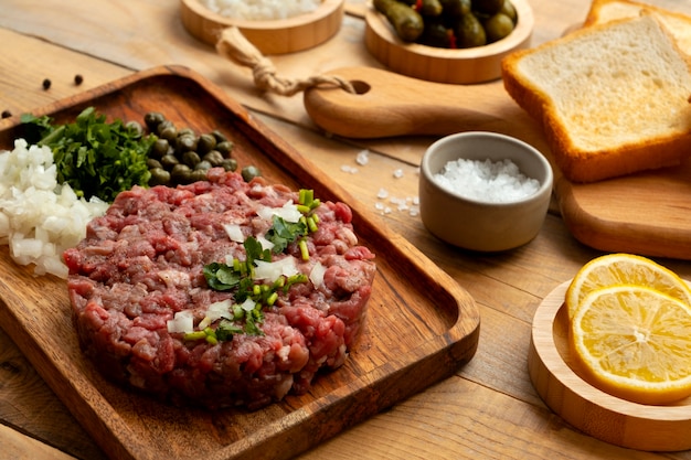 Free photo still life with beef steak tartar