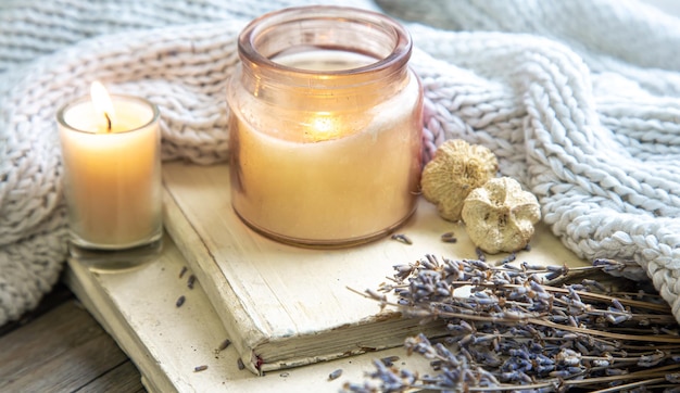 Still life with a candle and a knitted element