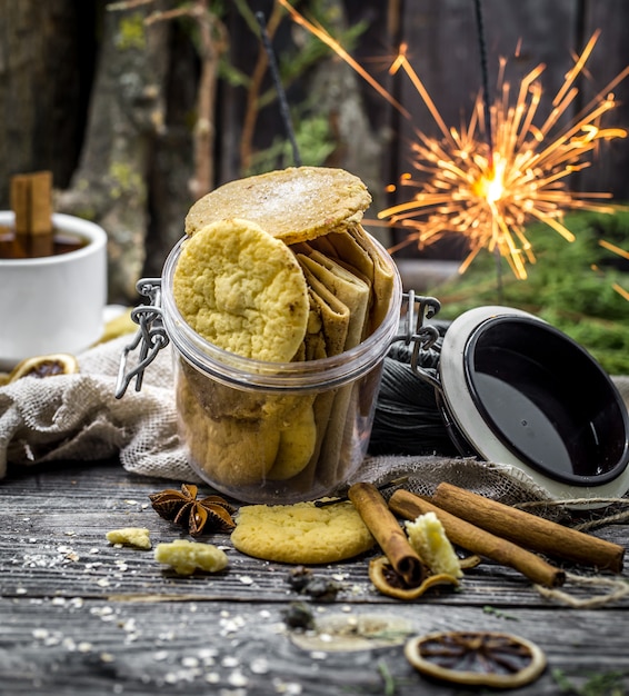 still life with cookies and sparklers on wood