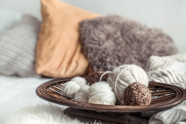 Free photo still life with a cozy variety of yarn for knitting.