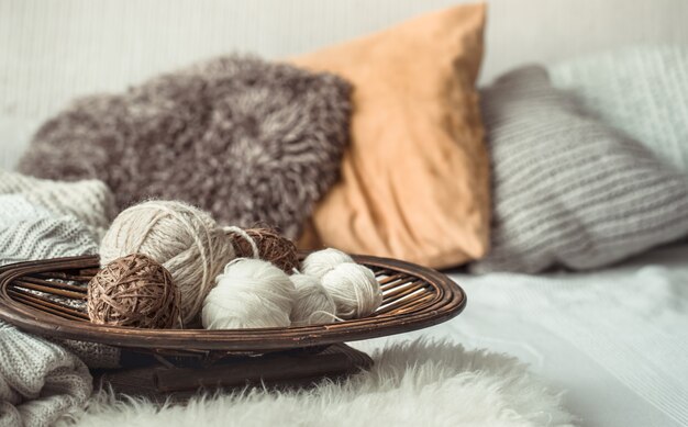 Still life with a cozy variety of yarn for knitting.