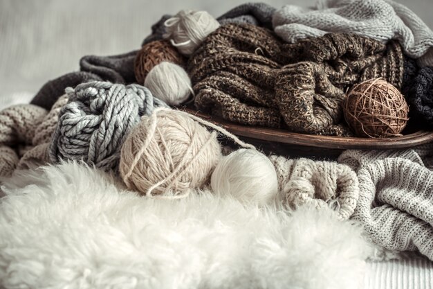 Still life with a cozy variety of yarn for knitting.