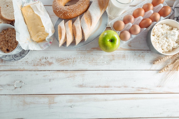 Still life with dairy products milk eggs bread