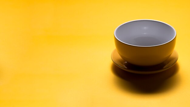 Still life of yellow cup