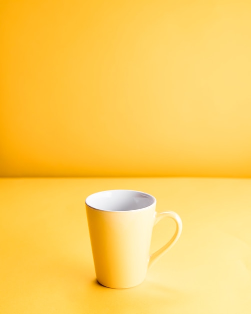 Still life of a yellow mug