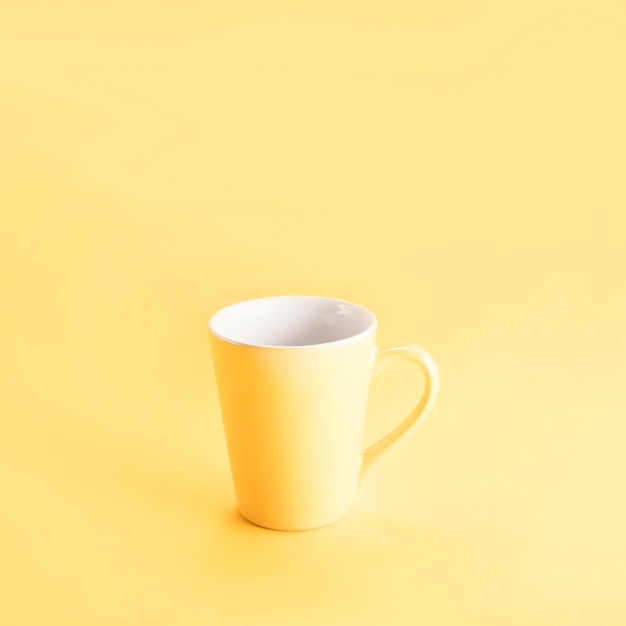 Free photo still life of a yellow mug