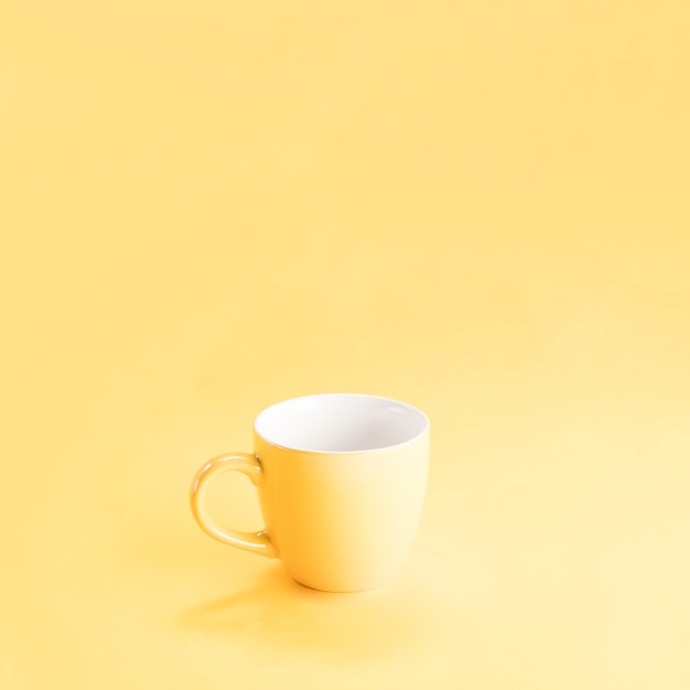 Still life of a yellow mug