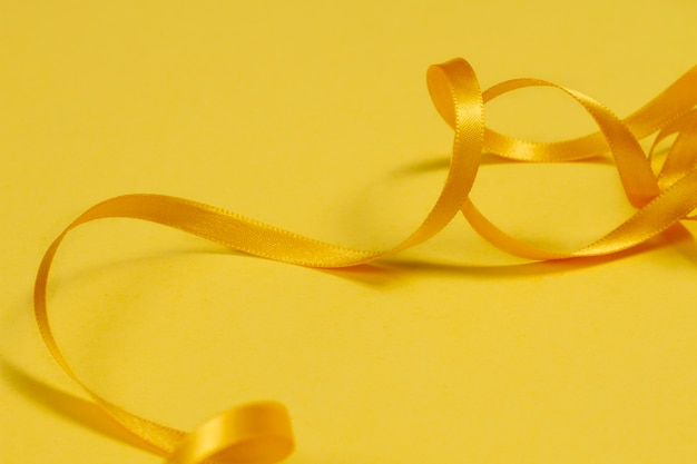 Free photo still life of yellow ribbon