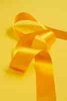 Free photo still life of yellow ribbon