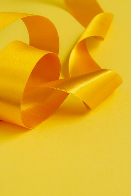 Free photo still life of yellow ribbon