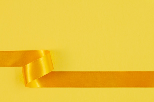 Free photo still life of yellow ribbon