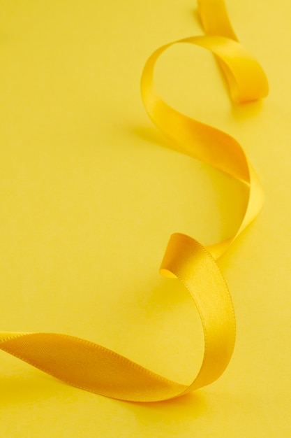 Free photo still life of yellow ribbon