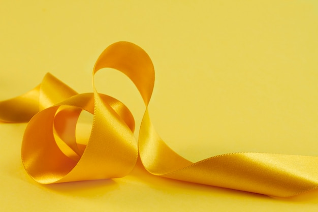 Free photo still life of yellow ribbon