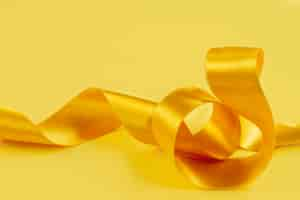 Free photo still life of yellow ribbon