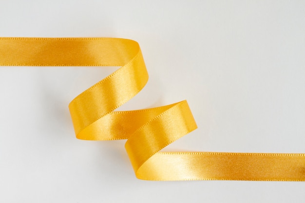 Free photo still life of yellow ribbon