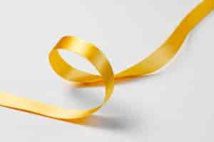 Free photo still life of yellow ribbon