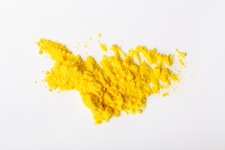 Free Photo still life yellow toner arrangement isolated