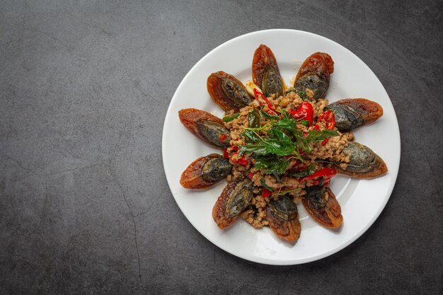 Stir Fried Basil with Spicy Century Egg Served with steamed rice and chili fish sauce, Thai food.