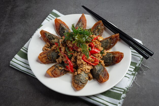 Stir Fried Basil with Spicy Century Egg Served with steamed rice and chili fish sauce, Thai food.