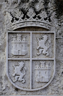Stone heraldic coat of arms on a wall in cuellar segovia