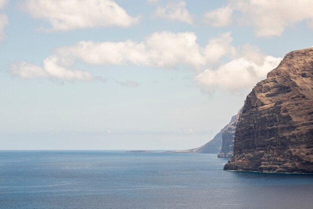 Stone littoral with cloudy sky