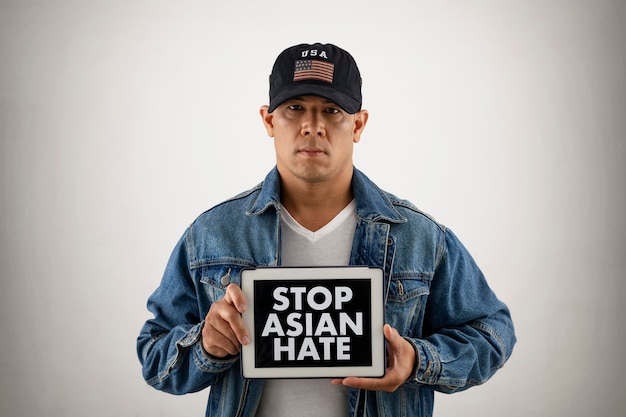 Free photo stop asian concept with man wearing hat