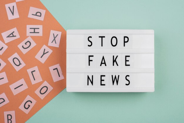 Stop fake news concept flat lay