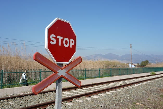 Stop warning sign on the rails in the station