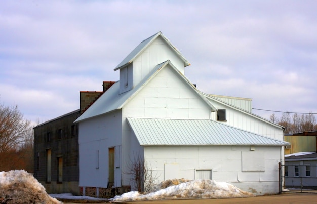 Storage house with a cloudy blue sky in the background