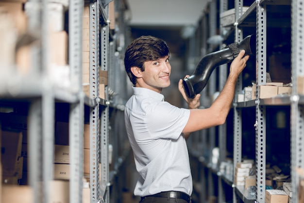 A store worker taking detail from the warehouse