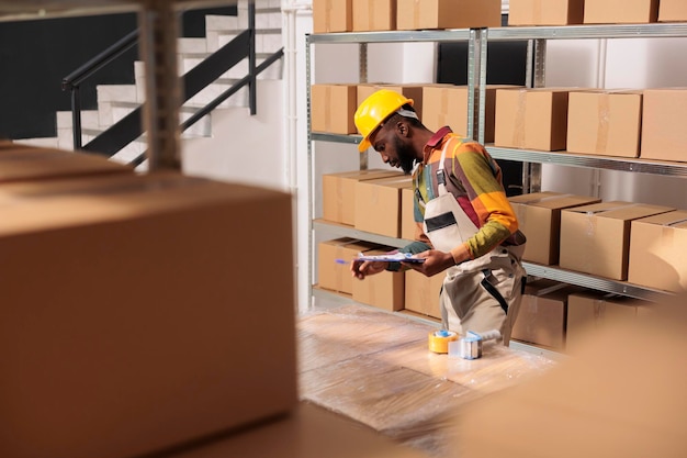 Storehouse supervisor analyzing merchandise checklist