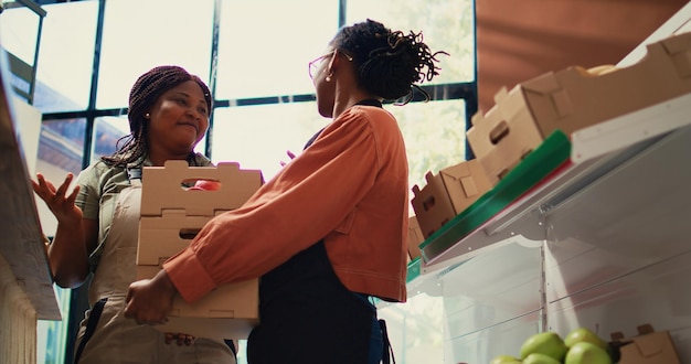 Free photo storekeeper receiving fresh supplies from local farm