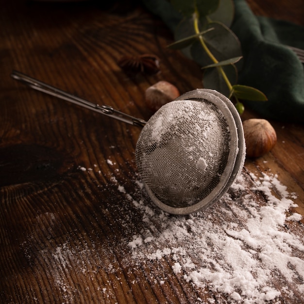 Strainer with powder sugar close up