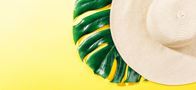 Free photo straw hat on bright yellow sunny background