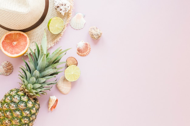 Straw hat with exotic fruits and shells